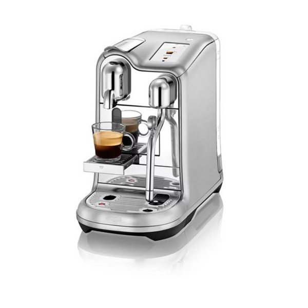 Machine à café Nespresso Creatista Pro de sage sur fond blanc